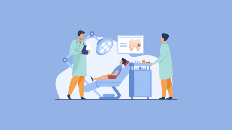 two dentists are performing checkups on a patient